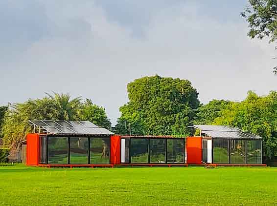 Solar powered containers with lushreen surroundings at 10Gulmohar